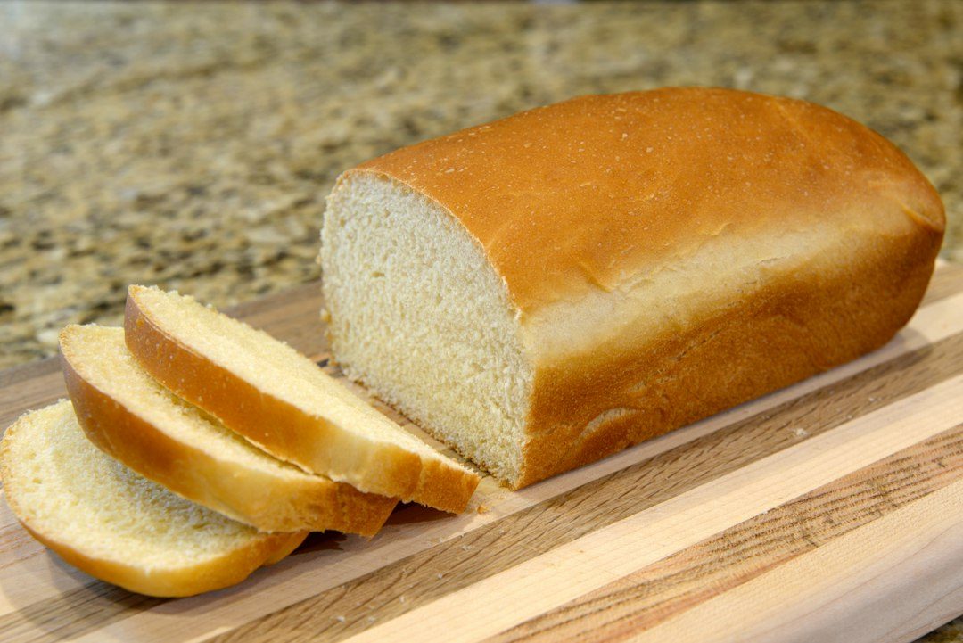 I made this bread from scratch using a recipe that has been in our family for 35 years. My uncle makes it every Christmas. I've always enjoyed eating it, but I am amazed at how much I enjoy making it. . Imagem ilustrativa para Receita de Pão Caseiro Fofinho da Vovó: O Segredo para um Pão Perfeito.